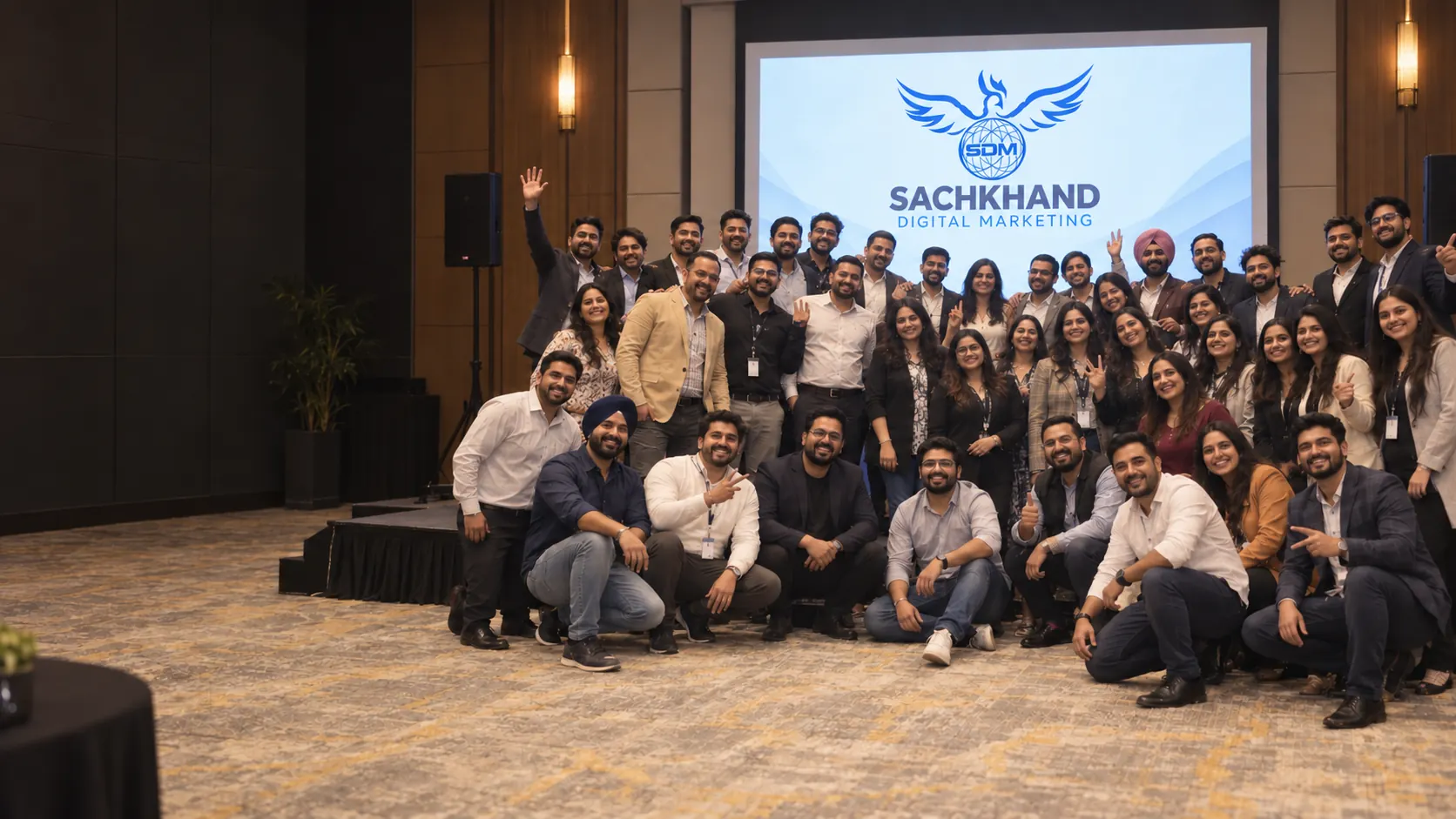 Digital marketing agency: Sachkhand Digital Marketing team at a company event beneath the SDM logo